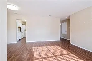 a view of an empty room and glass door