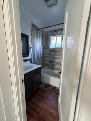a bathroom with a sink a mirror and a shower