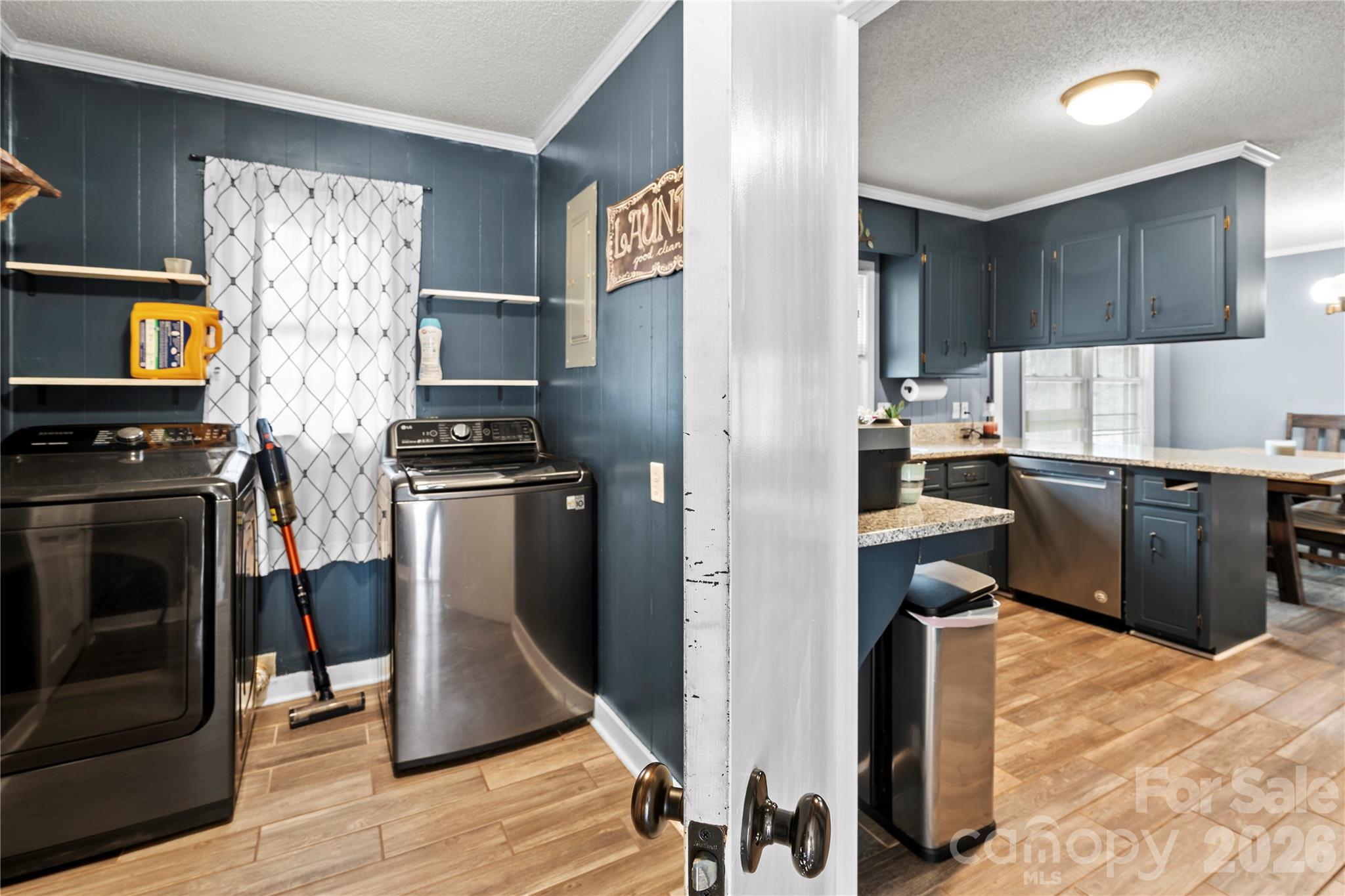 2231 Snuggs Park Road Albemarle, NC 28001 - Photo 11 of 30 a kitchen with stainless steel appliances a stove a refrigerator and a sink