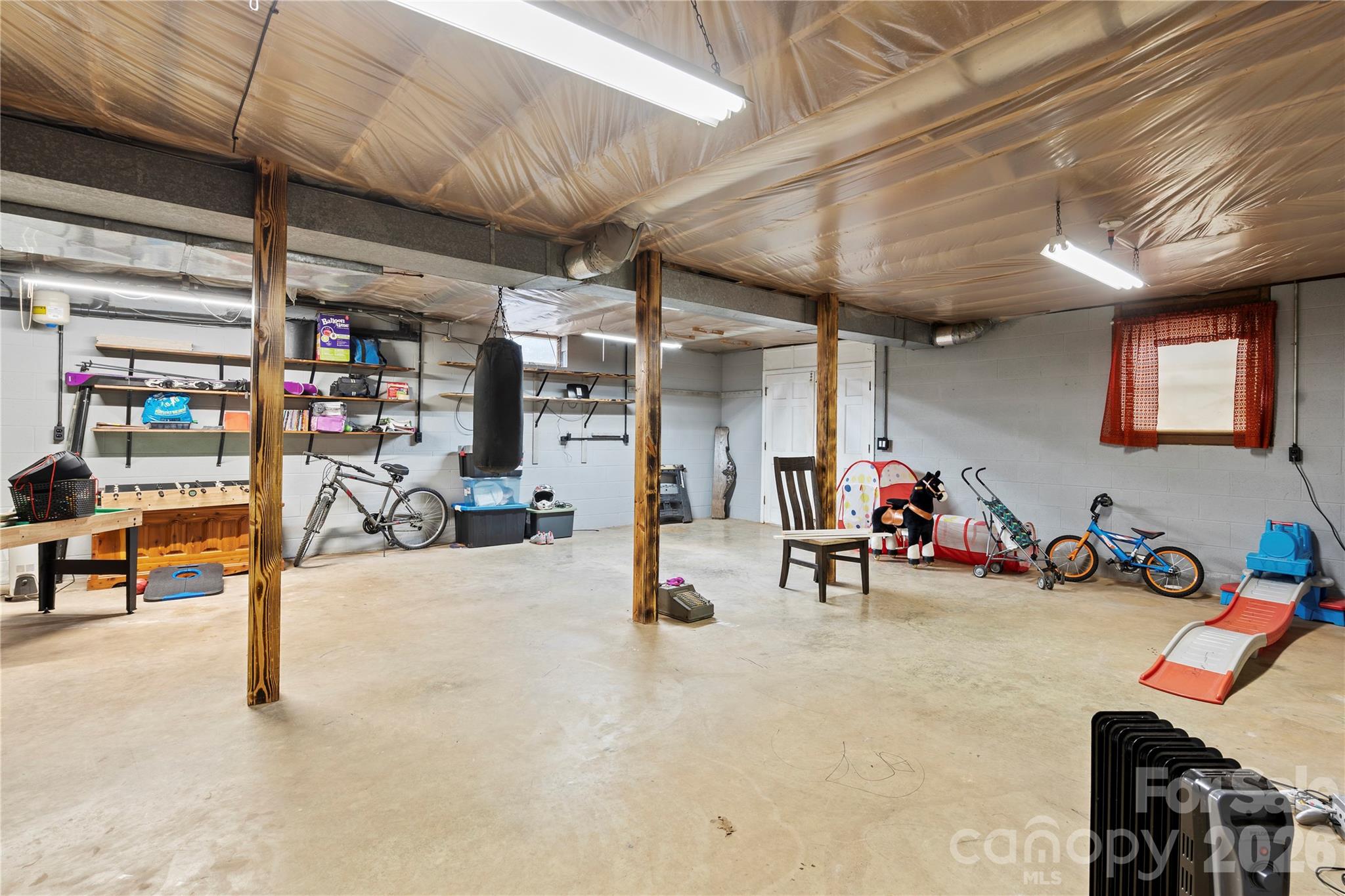 2231 Snuggs Park Road Albemarle, NC 28001 - Photo 18 of 30 a view of a room with gym equipment