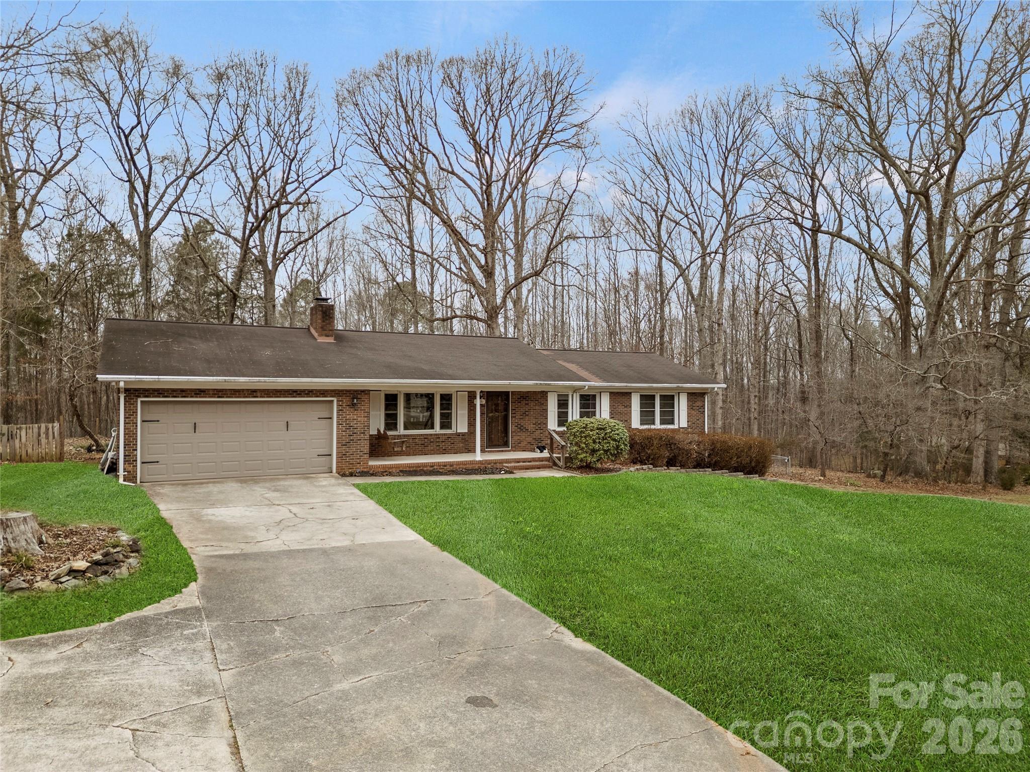 2231 Snuggs Park Road Albemarle, NC 28001 - Photo 2 of 30 front view of a house with a yard