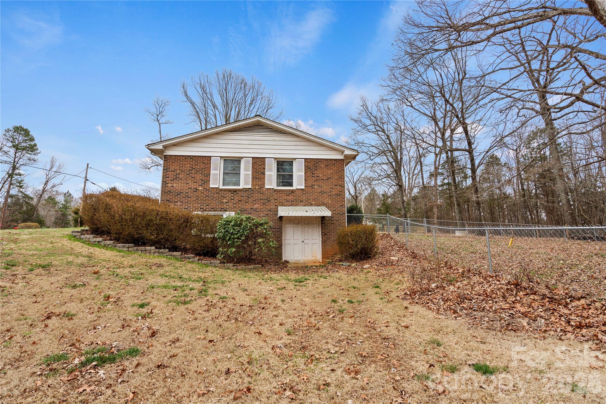 2231 Snuggs Park Road Albemarle, NC 28001 - Photo 24 of 30 a front view of a house with a yard