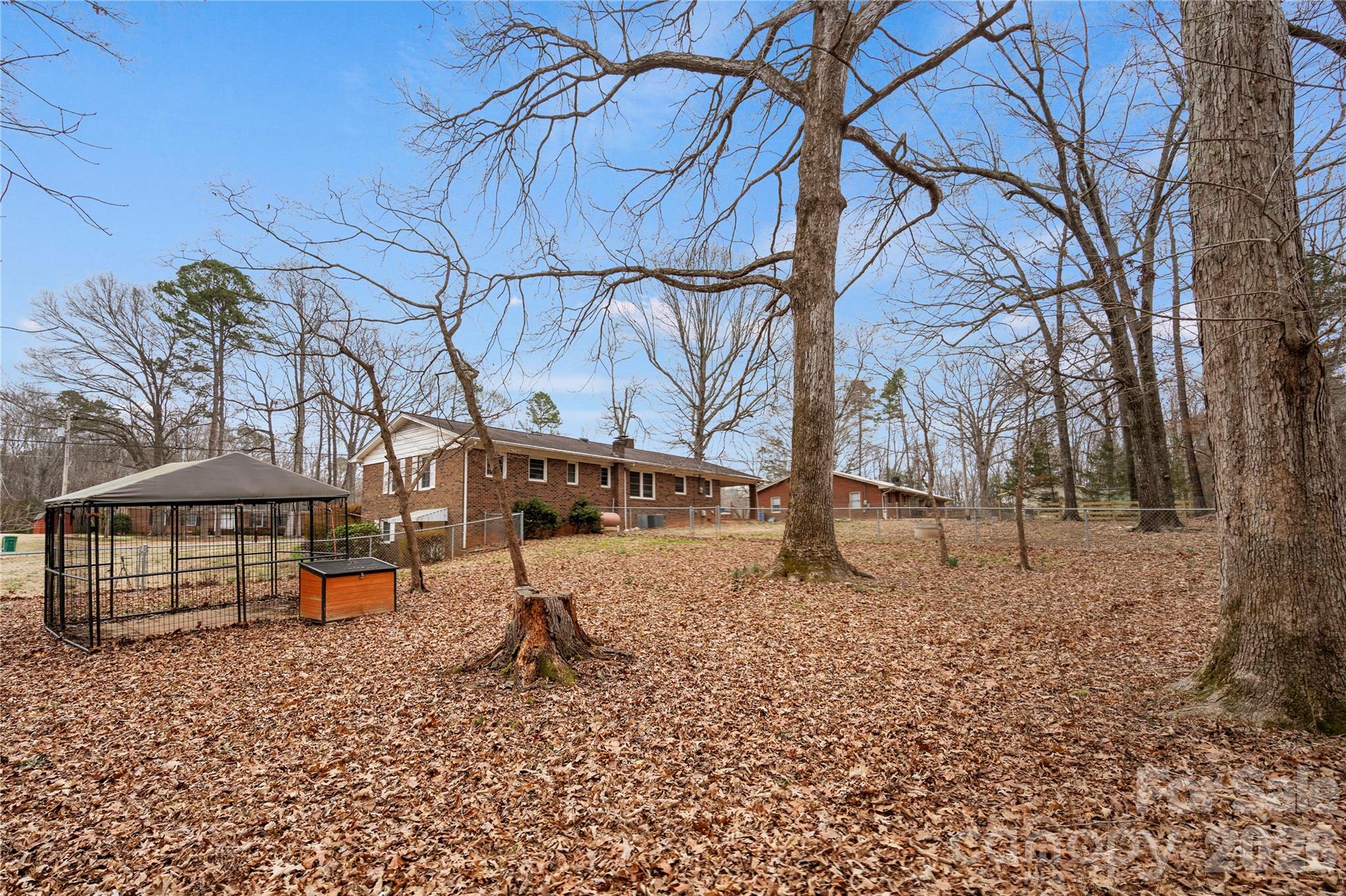2231 Snuggs Park Road Albemarle, NC 28001 - Photo 27 of 30 a backyard of a house with lots of green space