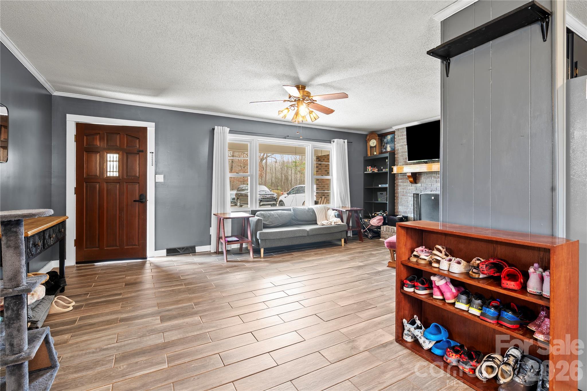 2231 Snuggs Park Road Albemarle, NC 28001 - Photo 6 of 30 a living room with furniture a rug and a flat screen tv