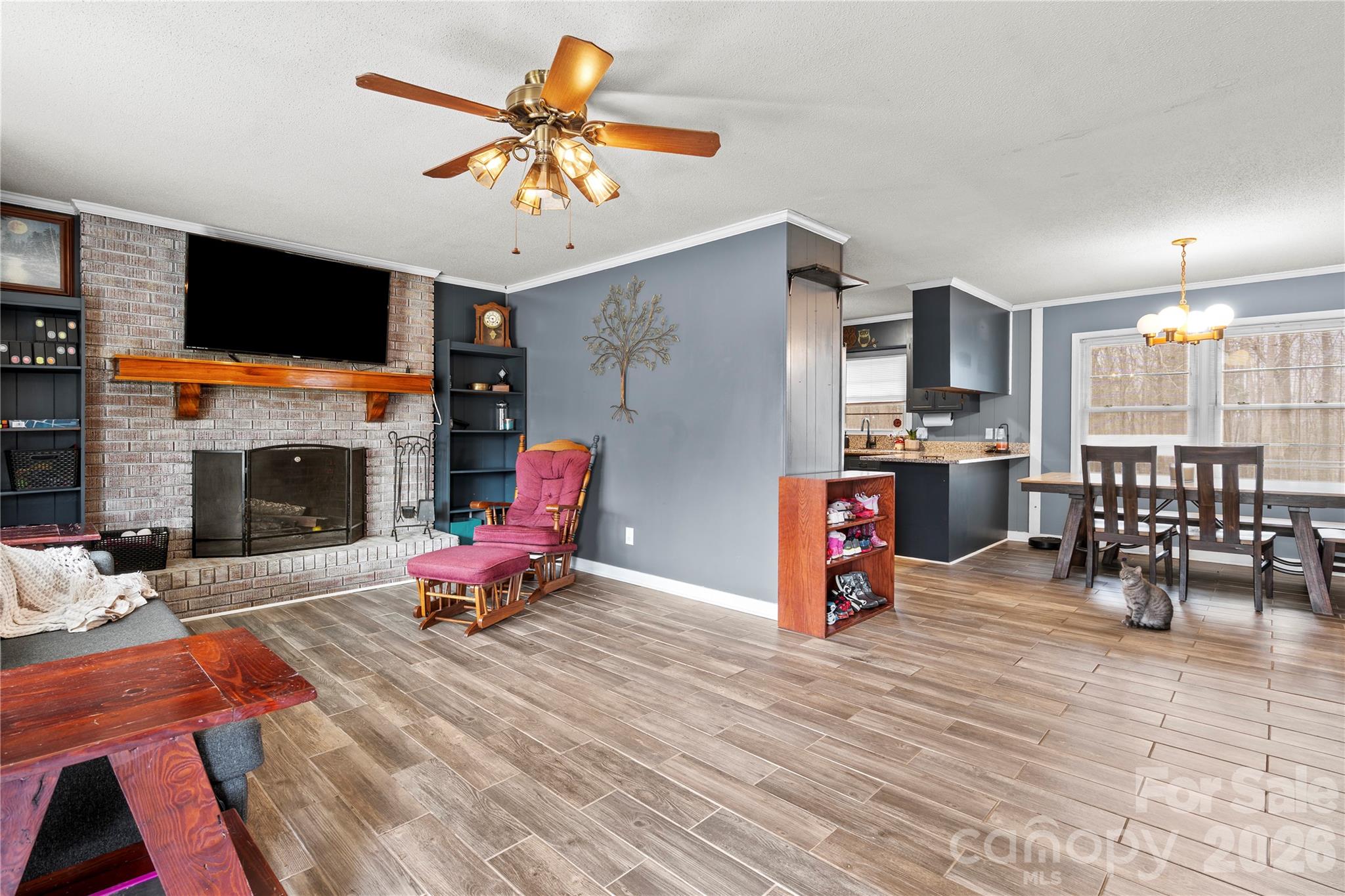 2231 Snuggs Park Road Albemarle, NC 28001 - Photo 7 of 30 a living room with furniture and a flat screen tv