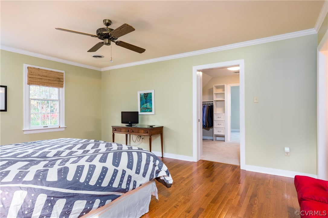 5705 North Chase Road Midlothian, VA 23112 - Photo 23 of 48 a bedroom with a bed and wooden floor