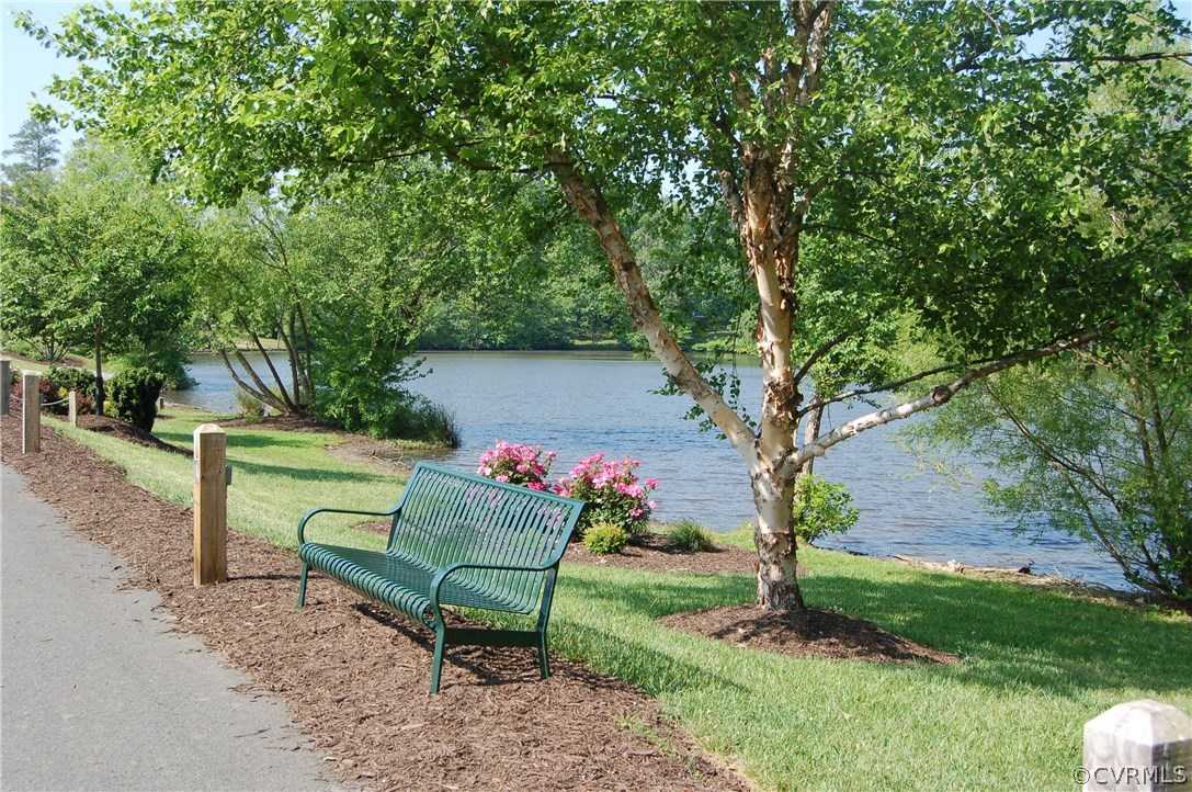 5705 North Chase Road Midlothian, VA 23112 - Photo 36 of 48 a garden with a bench and some trees