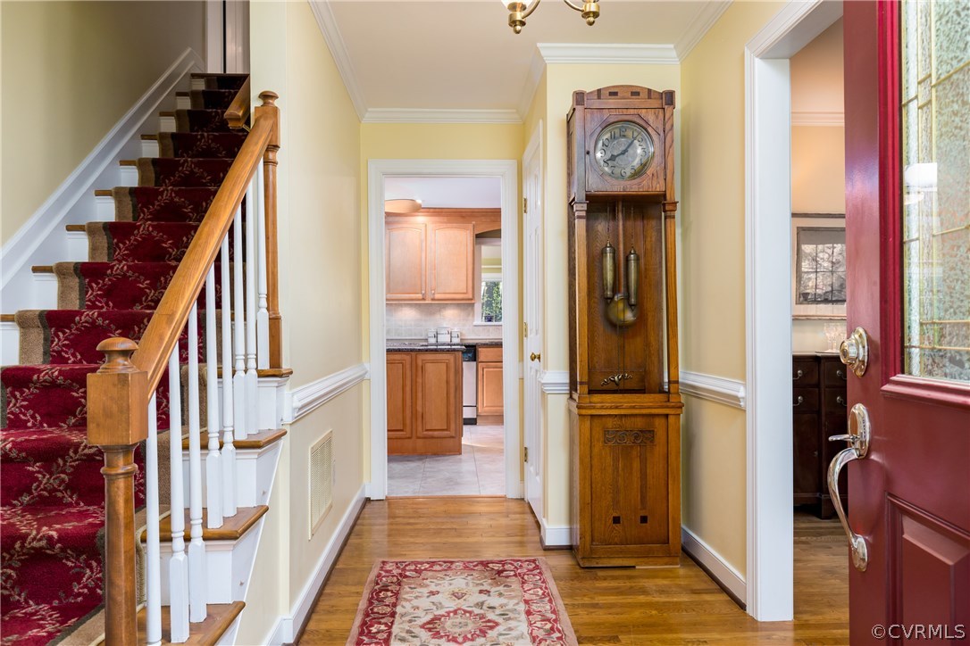 5705 North Chase Road Midlothian, VA 23112 - Photo 9 of 48 a view of a hallway with wooden floor and entryway