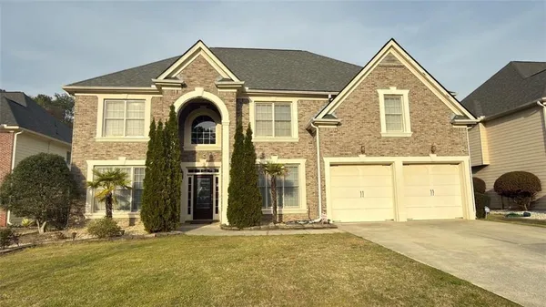 a front view of a house with a garage