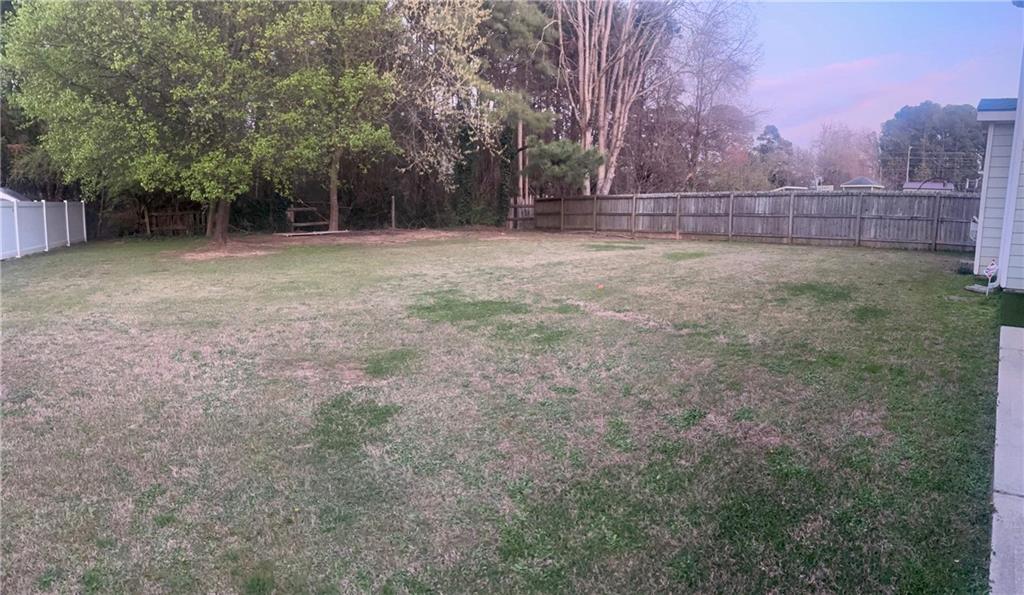 2966 Everson Ridge Court Southwest Snellville, GA 30039 - Photo 14 of 15 a view of outdoor space with deck and tree