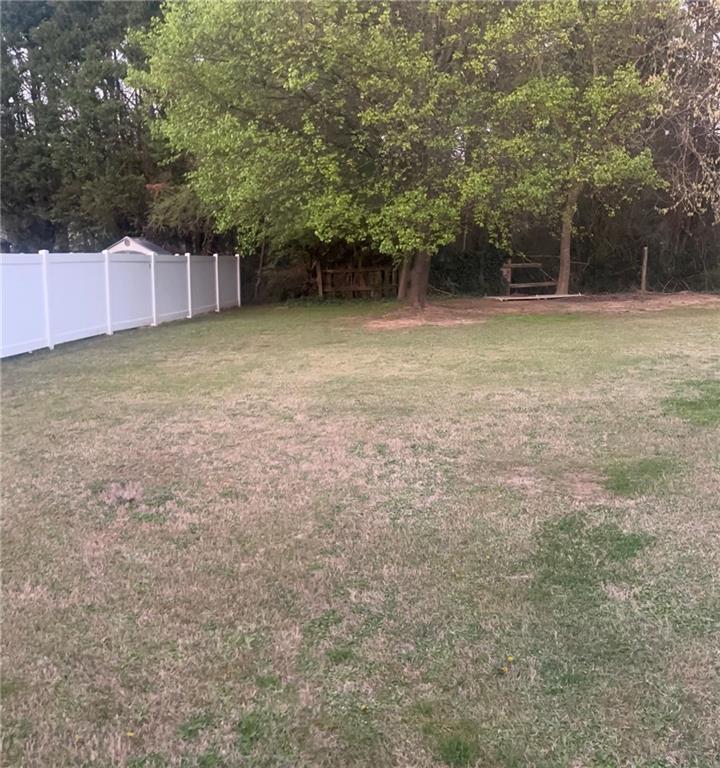 2966 Everson Ridge Court Southwest Snellville, GA 30039 - Photo 15 of 15 a backyard of a house with lots of green space