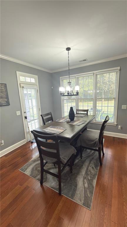 2966 Everson Ridge Court Southwest Snellville, GA 30039 - Photo 5 of 15 a view of a dining room with furniture wooden floor and chandelier