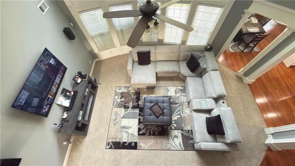 2966 Everson Ridge Court Southwest Snellville, GA 30039 - Photo 10 of 15 a living room with furniture and a fireplace