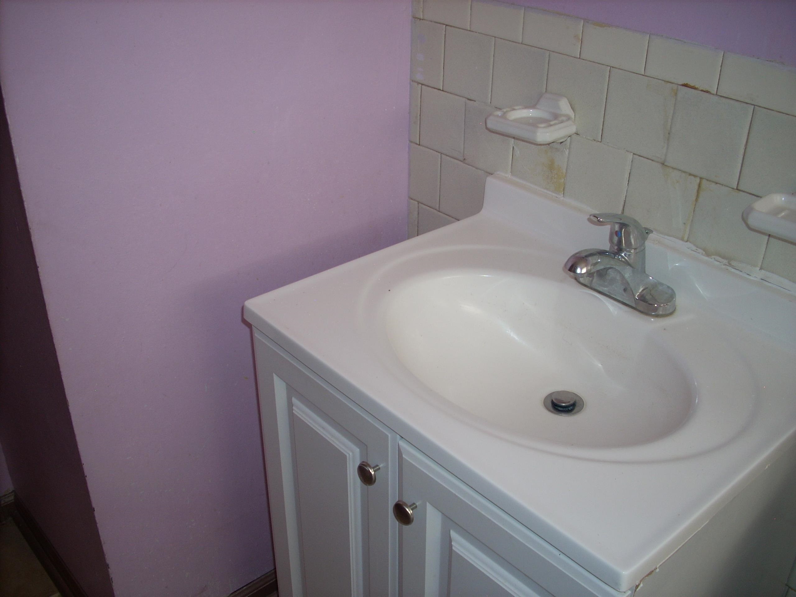 4282 Westmont Road Memphis, TN 38109 - Photo 11 of 15 White vanity with chrome faucet and integrated sink