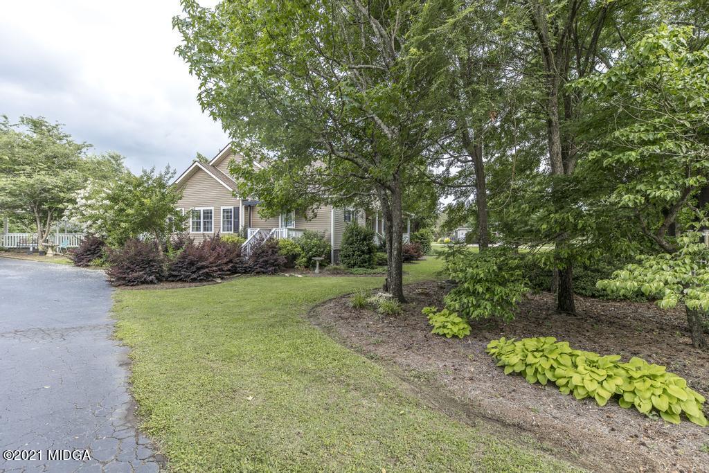 6246 Rogers Road Lizella, GA 31052 - Photo 2 of 48 a front view of a house with garden