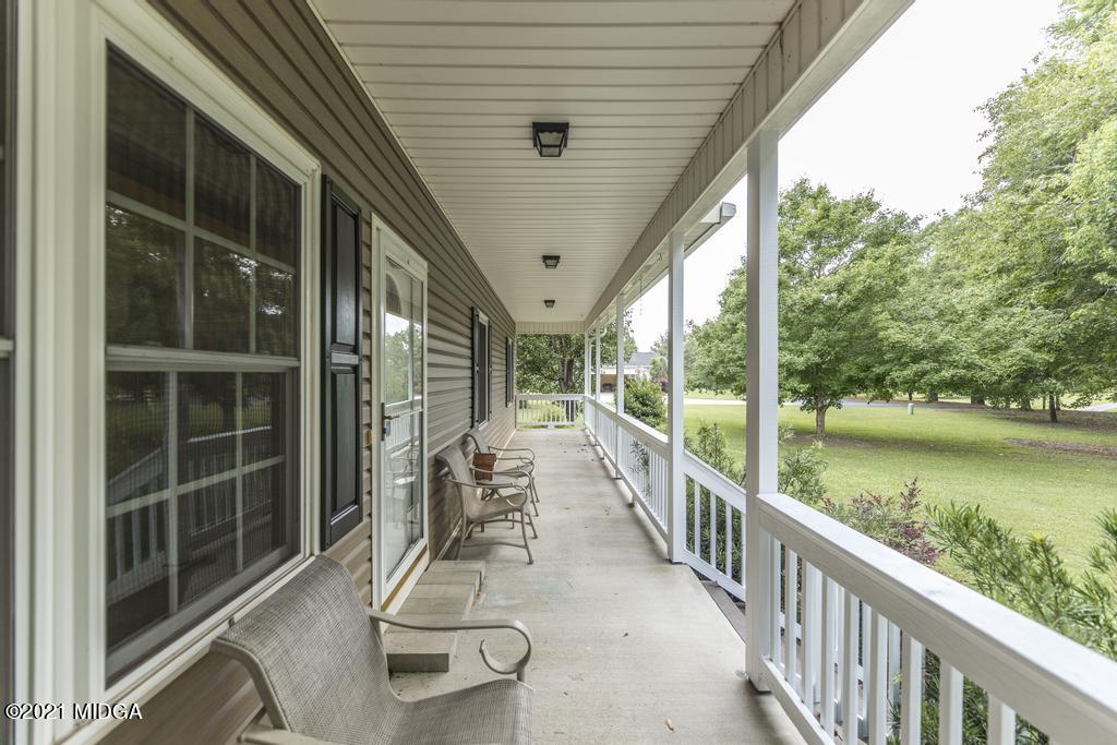 6246 Rogers Road Lizella, GA 31052 - Photo 11 of 48 a view of a balcony with lake view and a large window