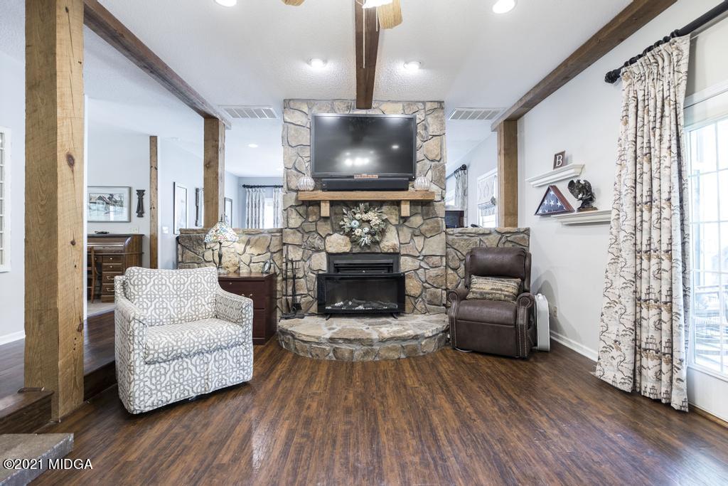 6246 Rogers Road Lizella, GA 31052 - Photo 14 of 48 a living room with furniture and a flat screen tv