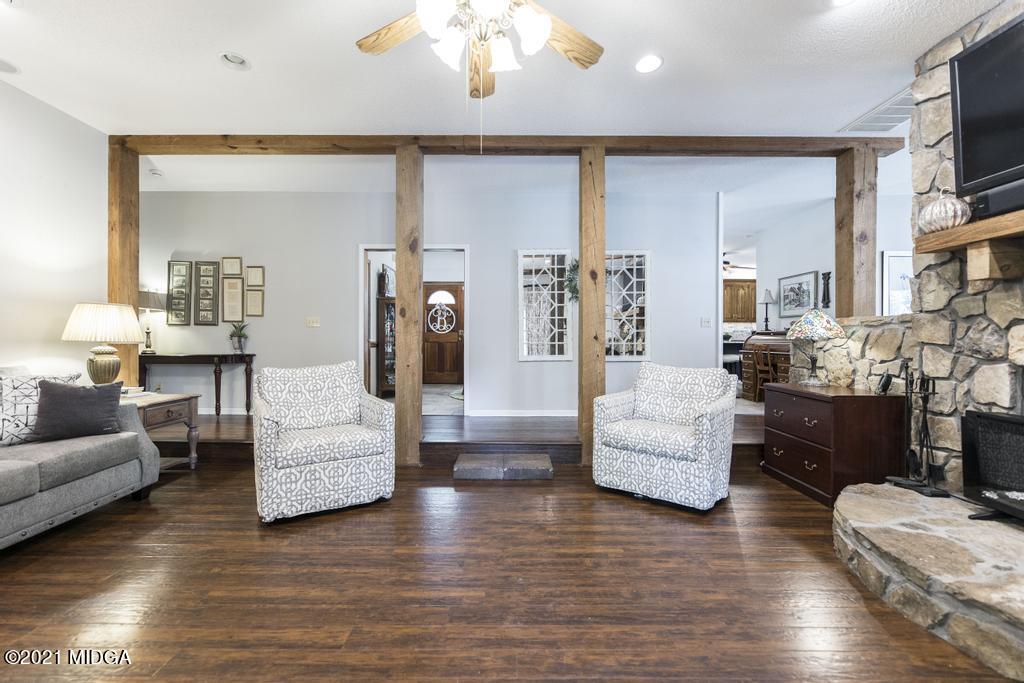 6246 Rogers Road Lizella, GA 31052 - Photo 15 of 48 a living room with furniture and a flat screen tv