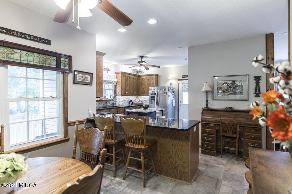 6246 Rogers Road Lizella, GA 31052 - Photo 18 of 48 a dining room with furniture and window