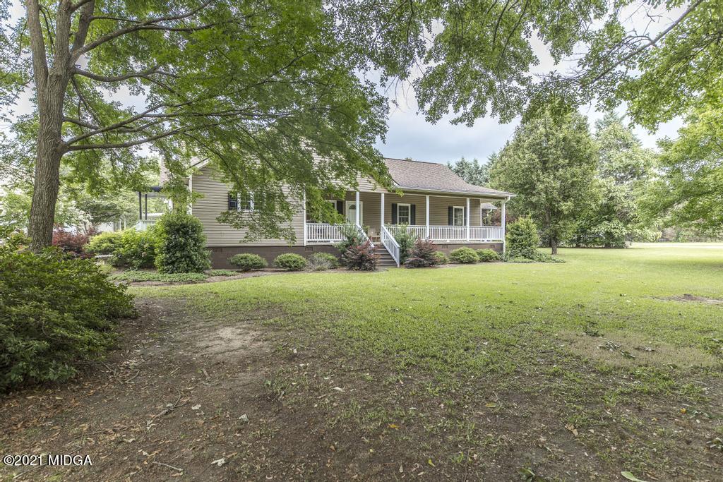 6246 Rogers Road Lizella, GA 31052 - Photo 3 of 48 a view of house with yard and green space