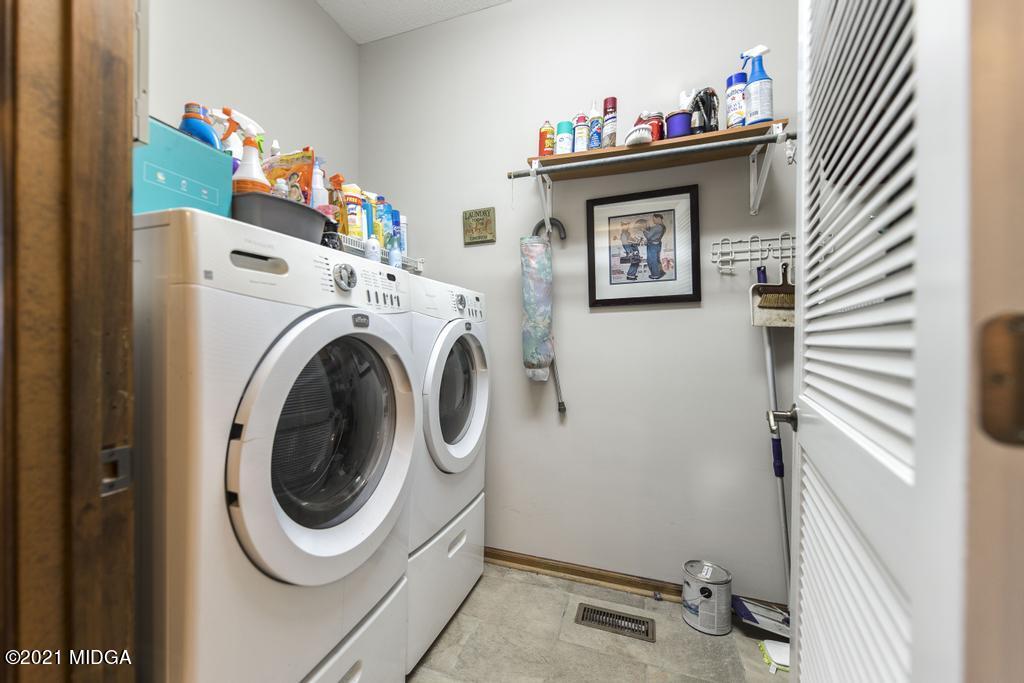 6246 Rogers Road Lizella, GA 31052 - Photo 25 of 48 a utility room with dryer and washer