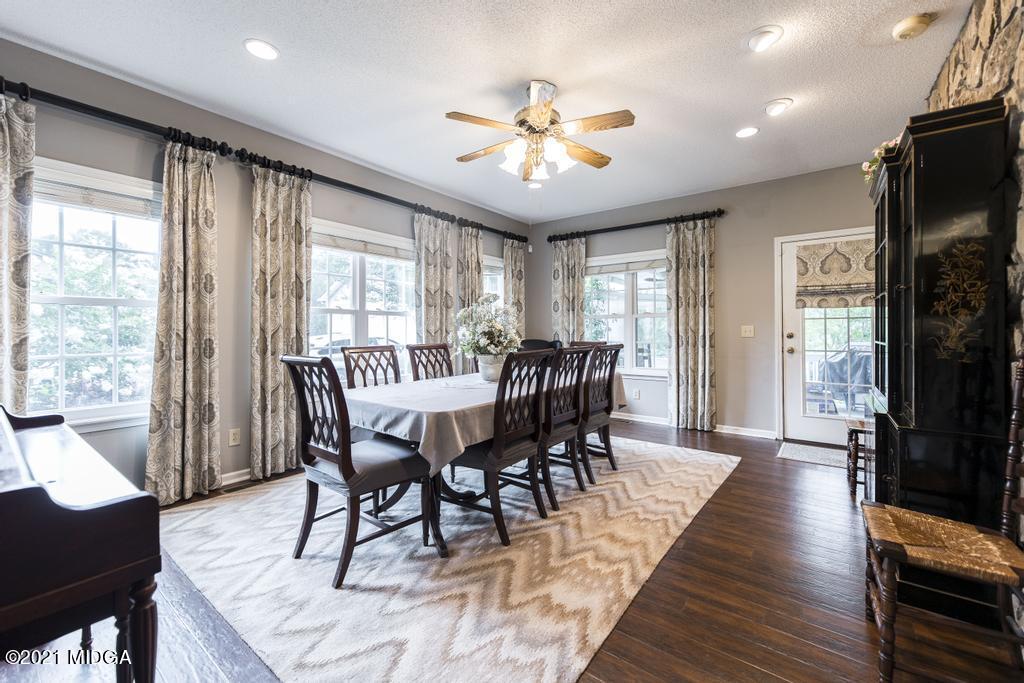 6246 Rogers Road Lizella, GA 31052 - Photo 26 of 48 a view of a dining room with furniture window and wooden floor