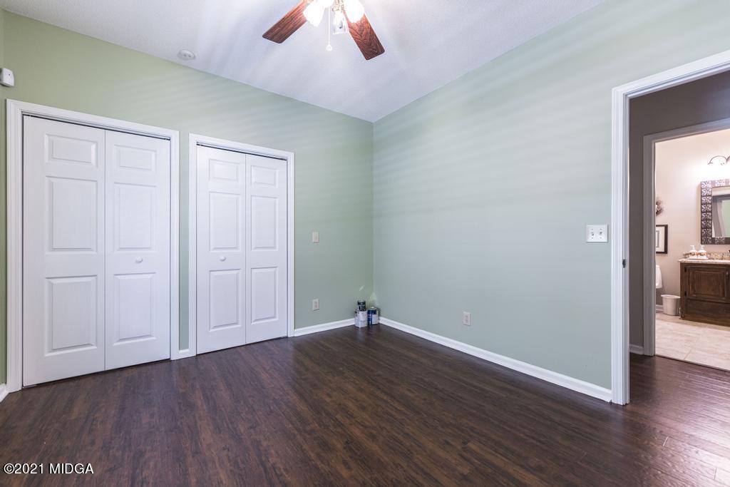 6246 Rogers Road Lizella, GA 31052 - Photo 29 of 48 an empty room with wooden floor and windows