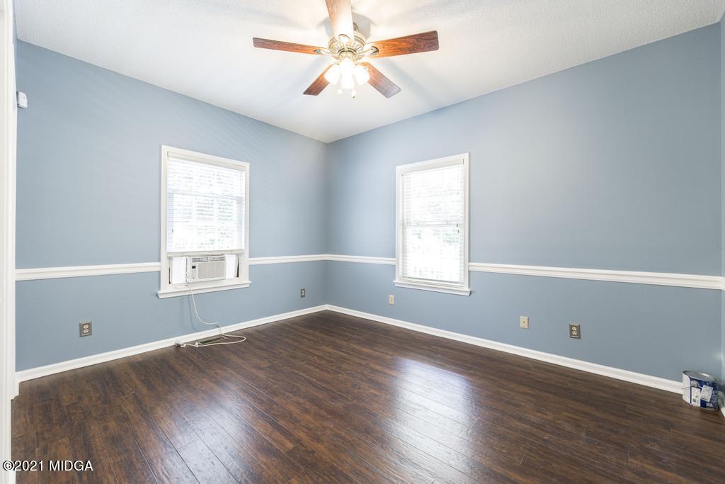 6246 Rogers Road Lizella, GA 31052 - Photo 30 of 48 a view of empty room with wooden floor and fan