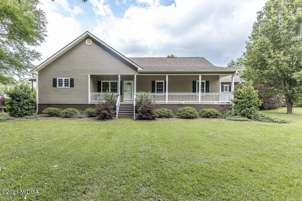6246 Rogers Road Lizella, GA 31052 - Photo 4 of 48 a view of a house with backyard and garden