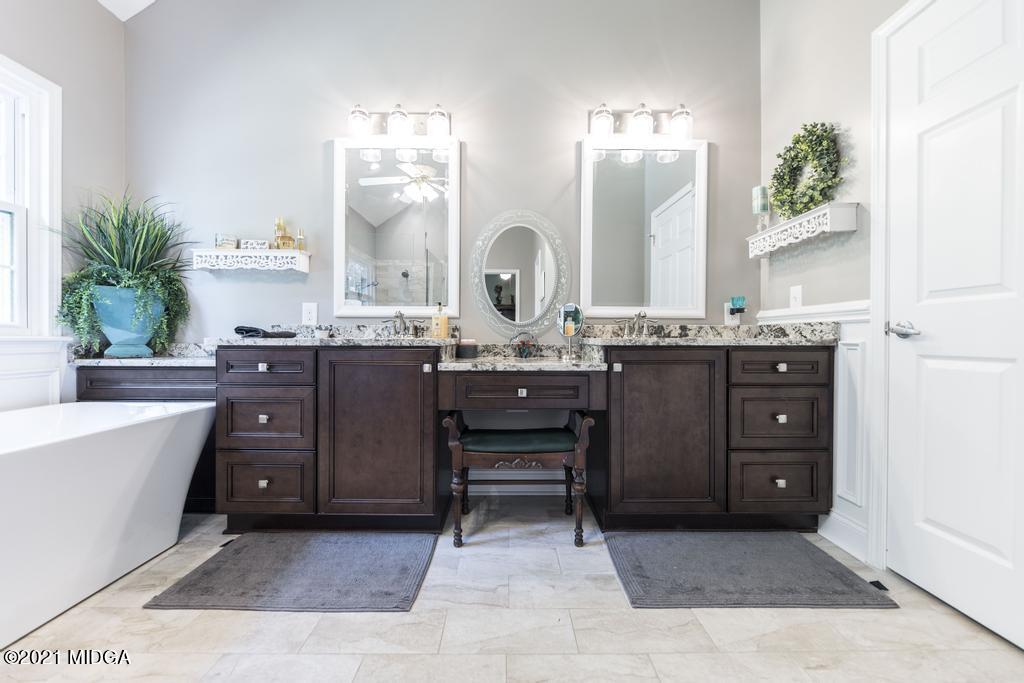 6246 Rogers Road Lizella, GA 31052 - Photo 36 of 48 a spacious bathroom with a double vanity sink and a mirror