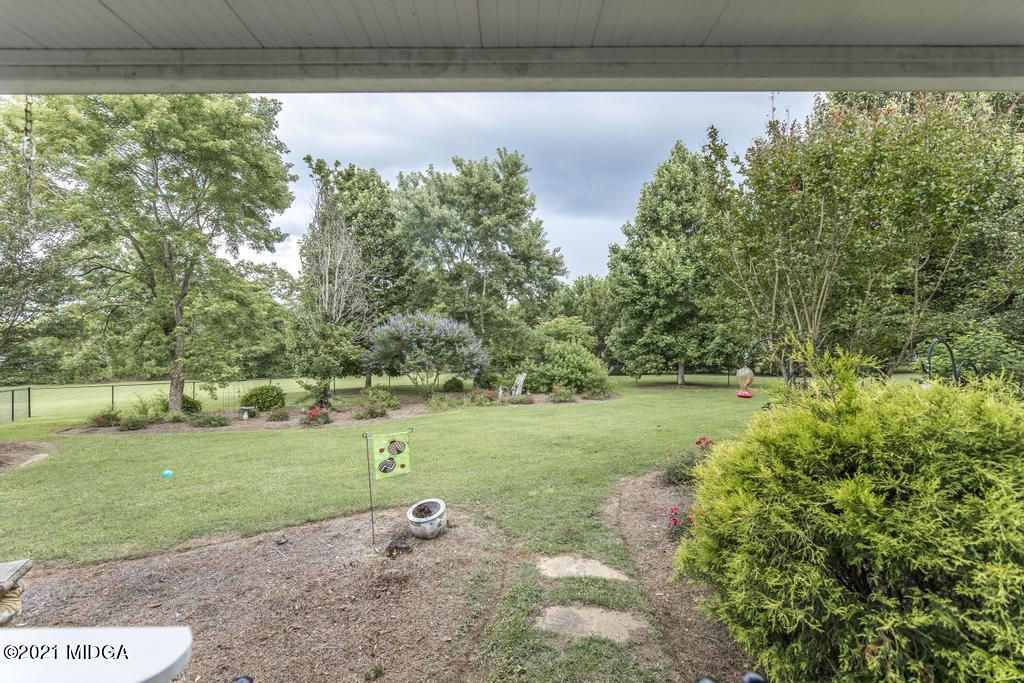 6246 Rogers Road Lizella, GA 31052 - Photo 41 of 48 a view of a yard with a large trees