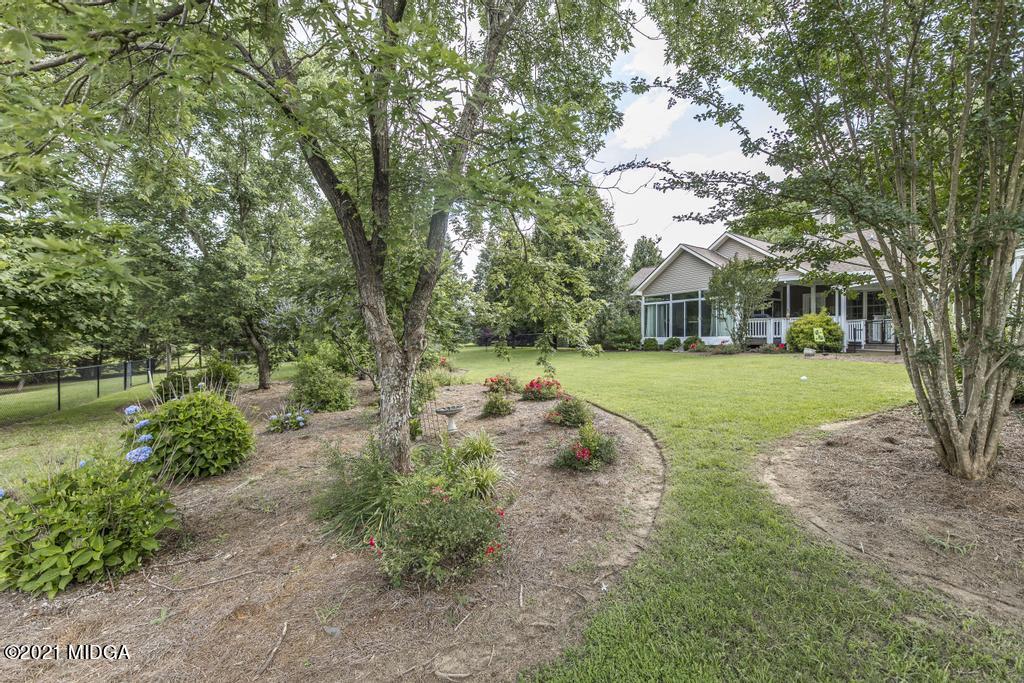 6246 Rogers Road Lizella, GA 31052 - Photo 42 of 48 a view of yard with swimming pool and green space