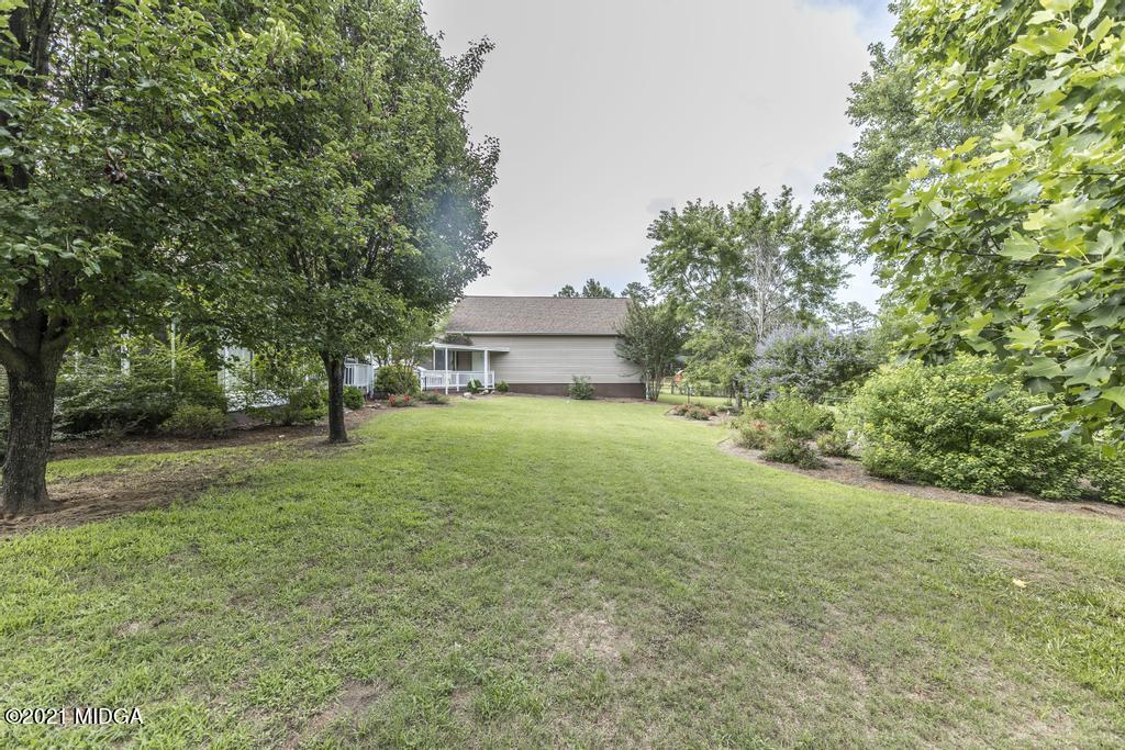 6246 Rogers Road Lizella, GA 31052 - Photo 43 of 48 a view of a house with backyard and tree