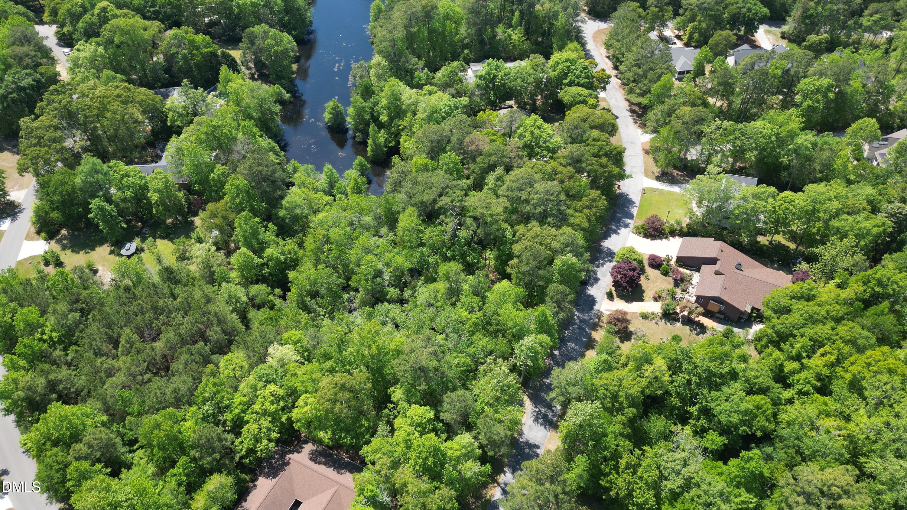 Lot A Coots Trail Hampstead, NC 28443 - Photo 9 of 10 an aerial view of a house with a yard and outdoor space