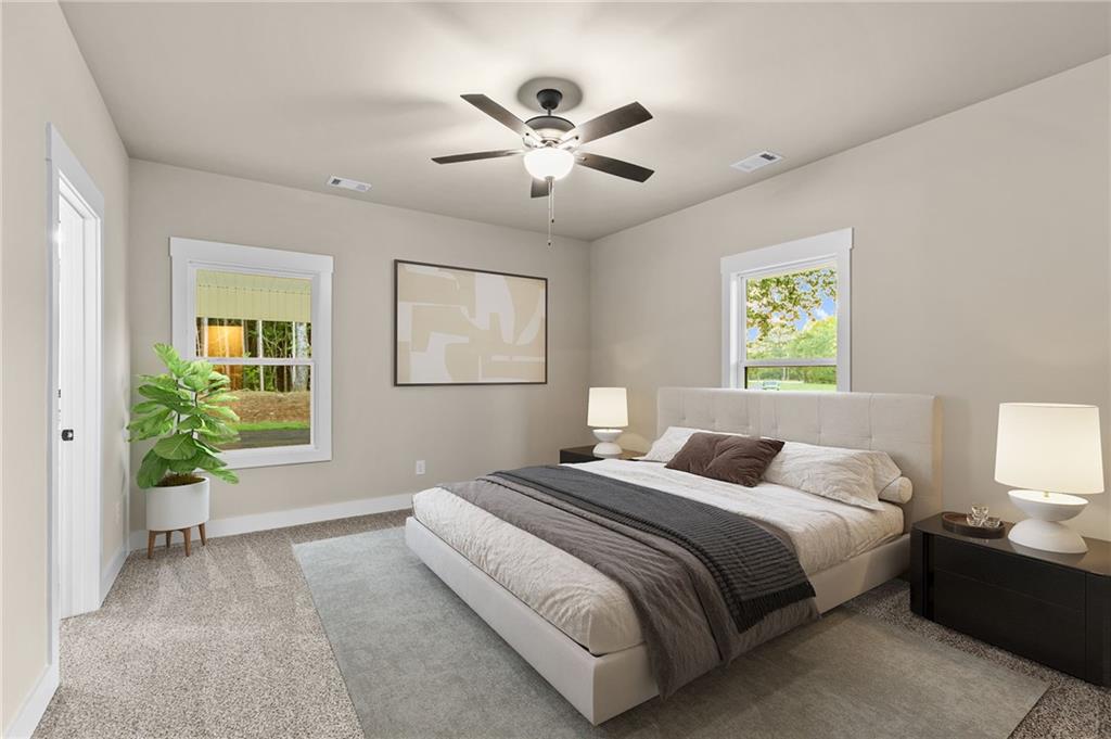 3512 Vinson Mountain Road Rockmart, GA 30153 - Photo 11 of 49 a bedroom with a large bed and a chandelier fan
