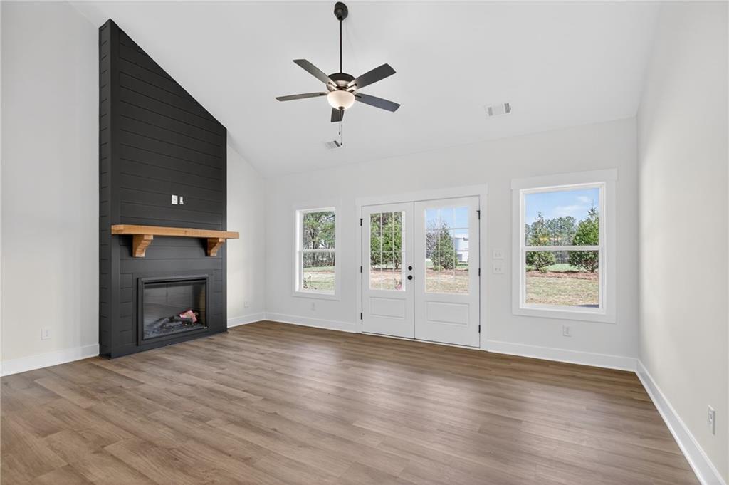 3512 Vinson Mountain Road Rockmart, GA 30153 - Photo 15 of 49 a view of an empty room with a fireplace and a window