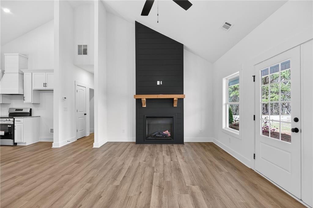 3512 Vinson Mountain Road Rockmart, GA 30153 - Photo 16 of 49 a view of an empty room with wooden floor and a window