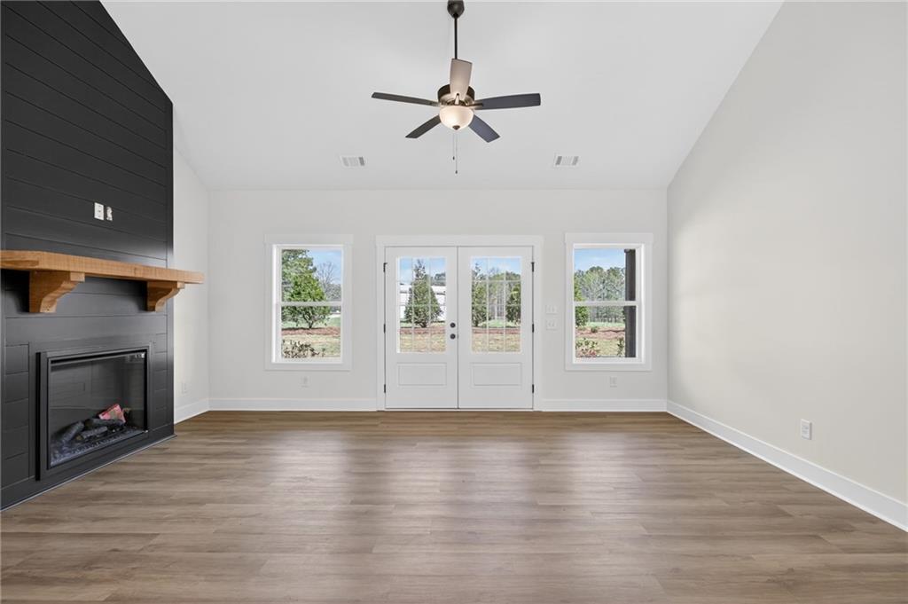 3512 Vinson Mountain Road Rockmart, GA 30153 - Photo 17 of 49 a view of room with window fireplace and wooden floor