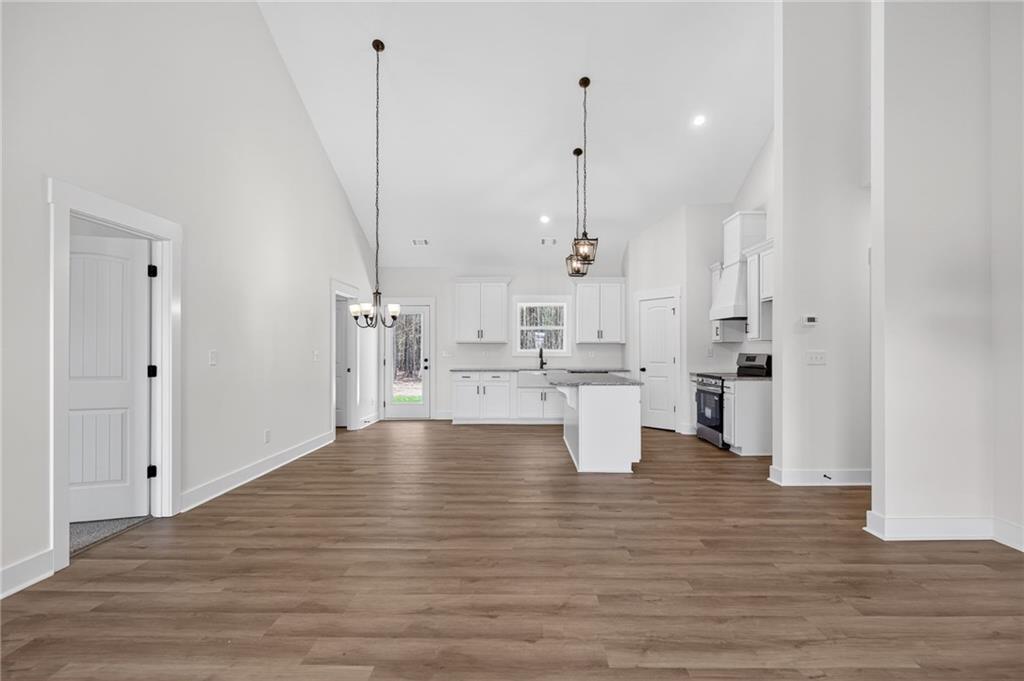 3512 Vinson Mountain Road Rockmart, GA 30153 - Photo 18 of 49 a view of a kitchen with kitchen island white cabinets and stainless steel appliances