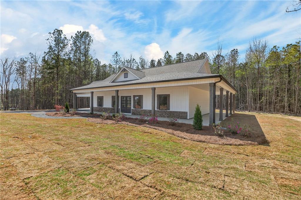 3512 Vinson Mountain Road Rockmart, GA 30153 - Photo 2 of 49 a front view of house with yard and trees in the background