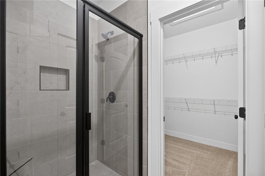 3512 Vinson Mountain Road Rockmart, GA 30153 - Photo 31 of 49 a bathroom with a glass shower door