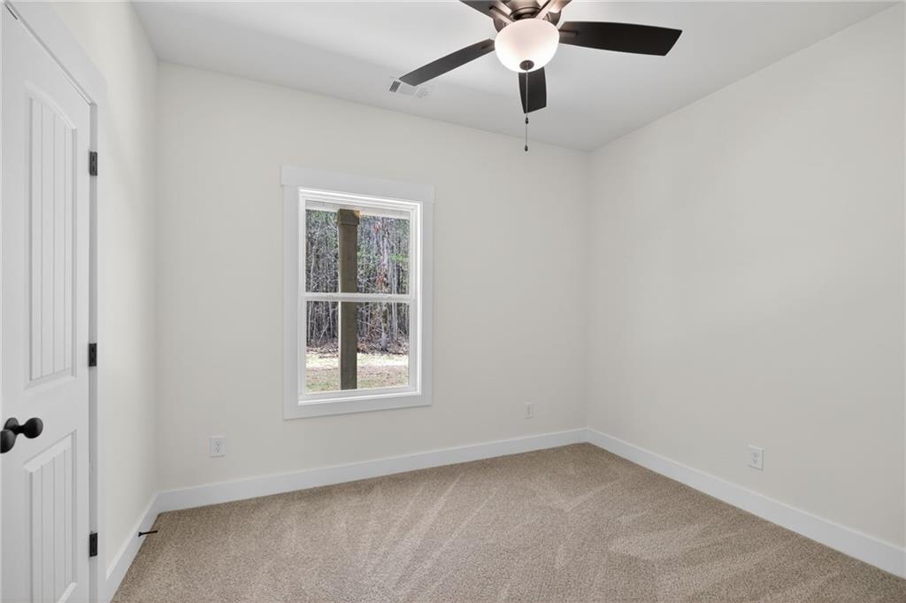 3512 Vinson Mountain Road Rockmart, GA 30153 - Photo 37 of 49 an empty room with a window and a fan