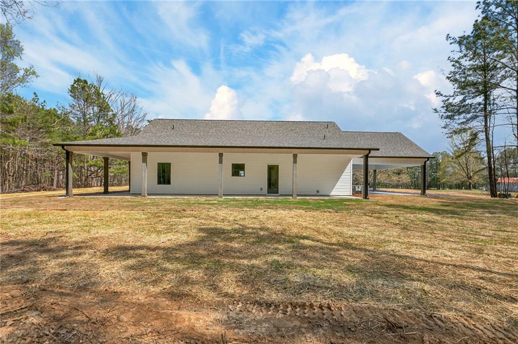 3512 Vinson Mountain Road Rockmart, GA 30153 - Photo 39 of 49 a front view of house with yard and trees