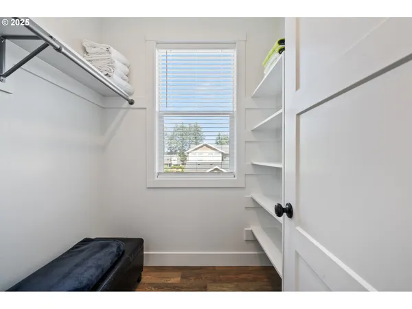a view of an entryway with wooden floor