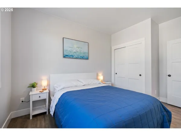 a bedroom with a bed and a table in it