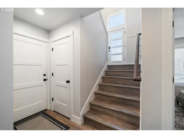 a view of entryway with wooden floor