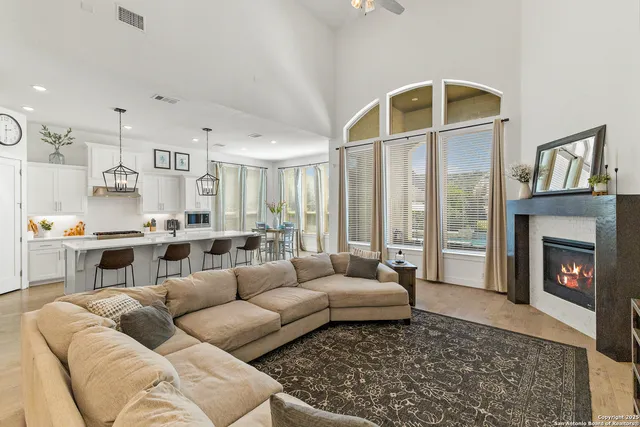 a living room with furniture and a fireplace