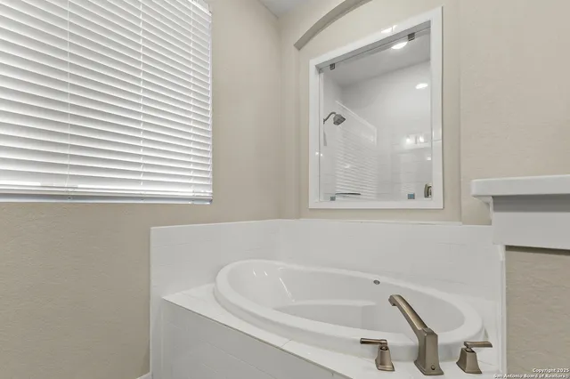 a bathroom with a bathtub and a sink