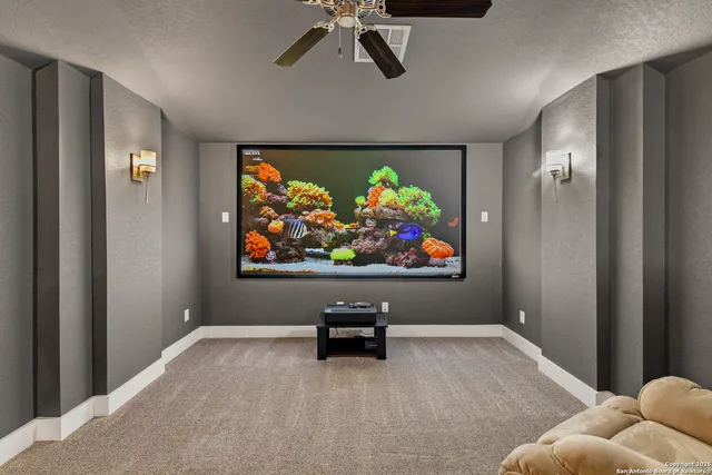 a living room with furniture and a rug