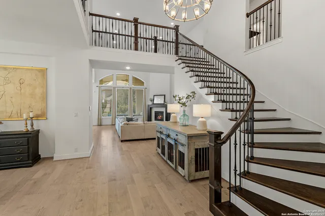 a view of entryway livingroom and hall with wooden floor